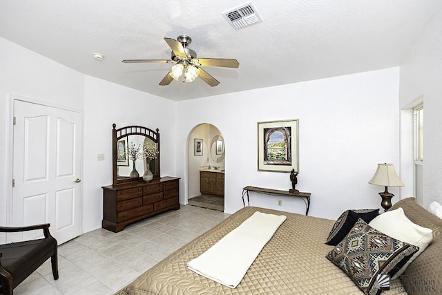 bedroom featuring ensuite bathroom and ceiling fan