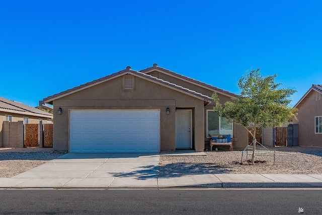 single story home featuring a garage