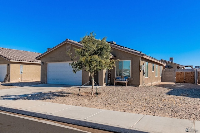 single story home featuring a garage