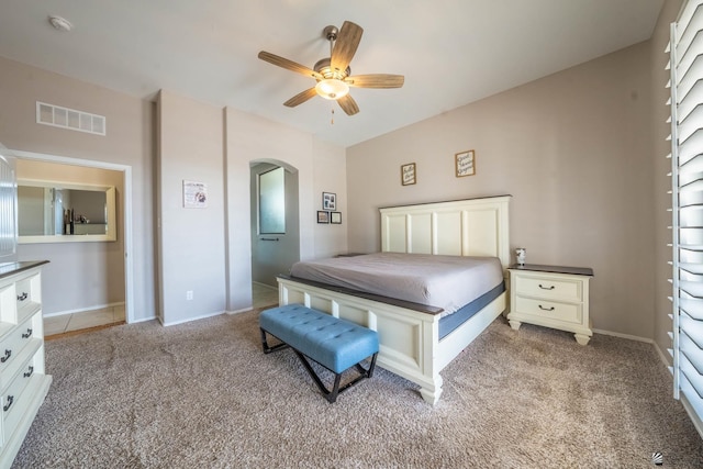 bedroom featuring light carpet and ceiling fan