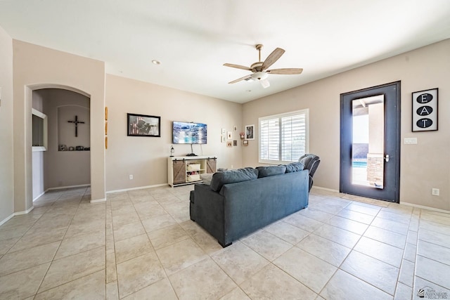 living room with light tile patterned floors and ceiling fan