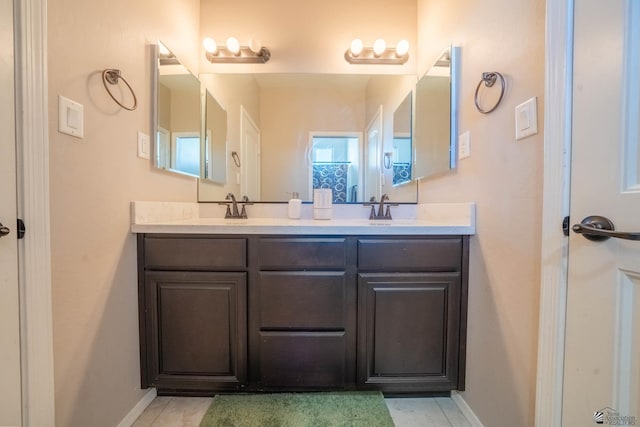 bathroom featuring tile patterned floors and vanity