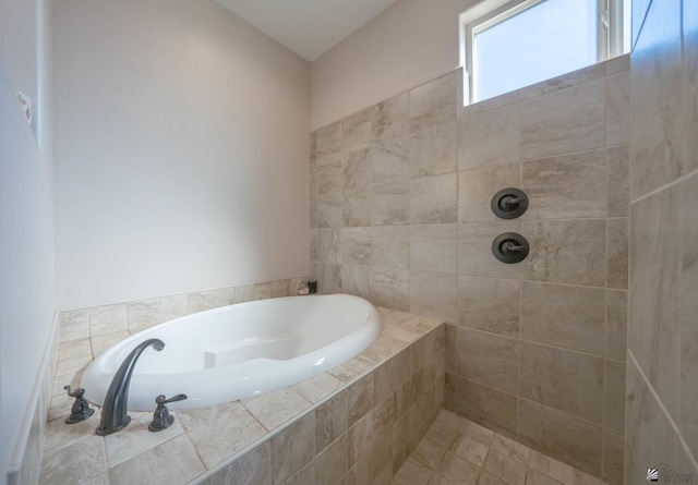 bathroom with tiled tub