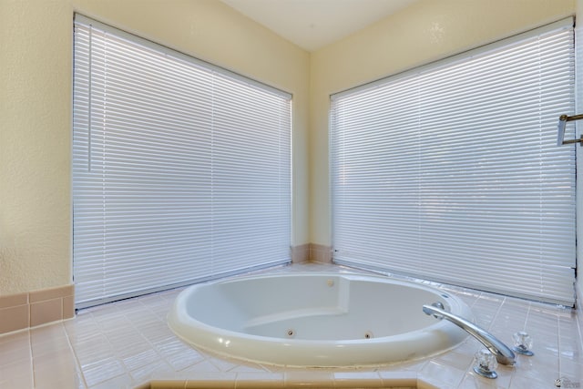 full bathroom featuring a jetted tub