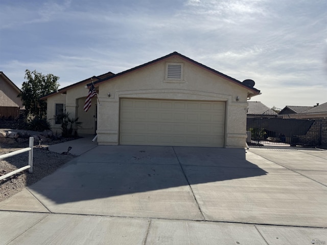 ranch-style house featuring a garage