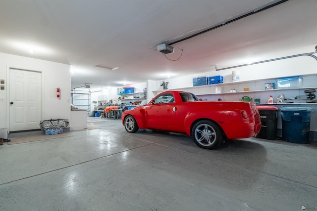 garage featuring a garage door opener