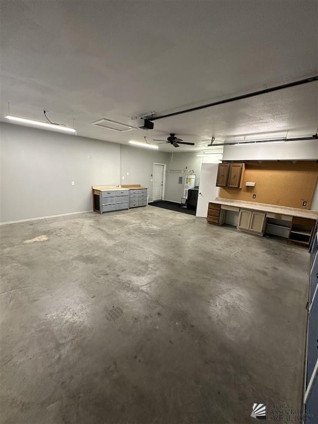 garage with a workshop area and a garage door opener