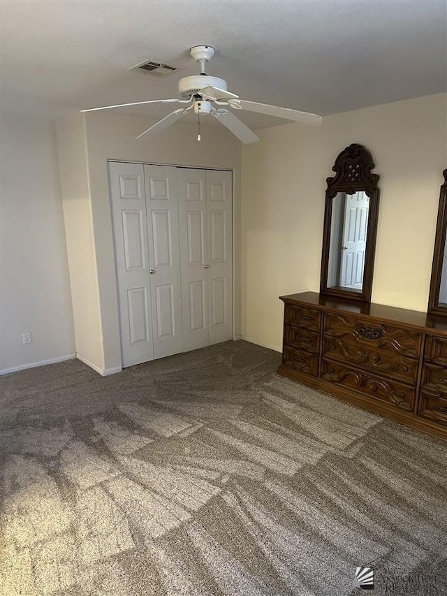 unfurnished bedroom featuring carpet flooring, ceiling fan, and a closet