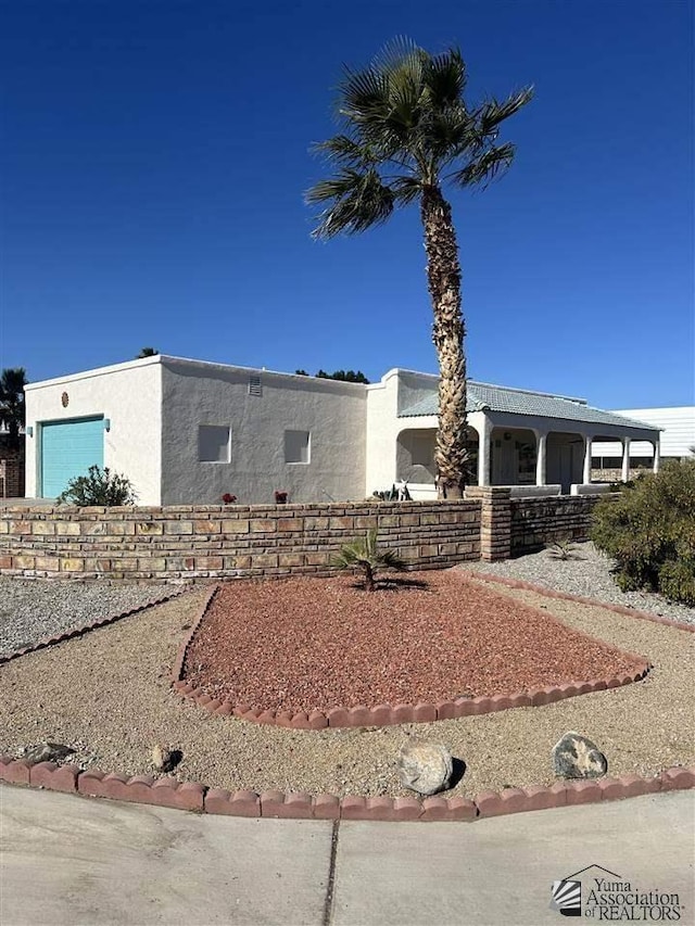 view of front of home featuring a garage