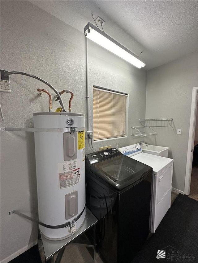 washroom featuring a textured ceiling, sink, separate washer and dryer, and water heater