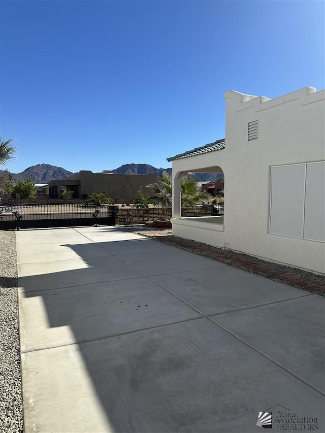 view of patio / terrace with a mountain view