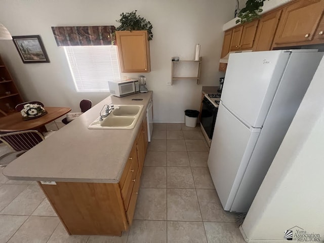 kitchen featuring white appliances, light tile patterned floors, light countertops, and a sink