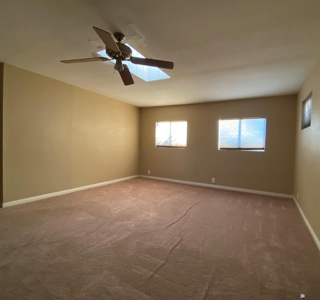 carpeted empty room with ceiling fan