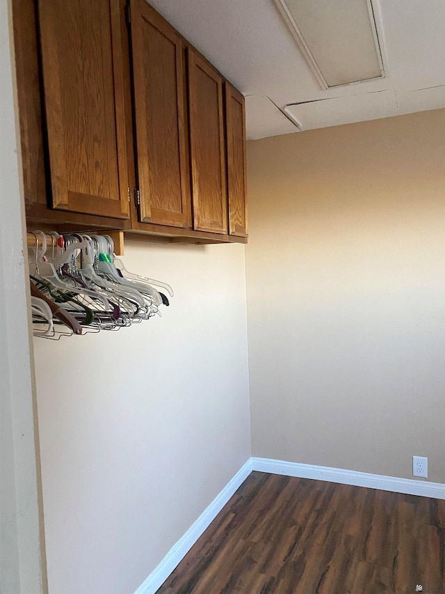 laundry area featuring dark hardwood / wood-style flooring