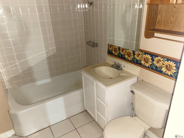 full bathroom with tile patterned flooring, vanity, toilet, and tiled shower / bath