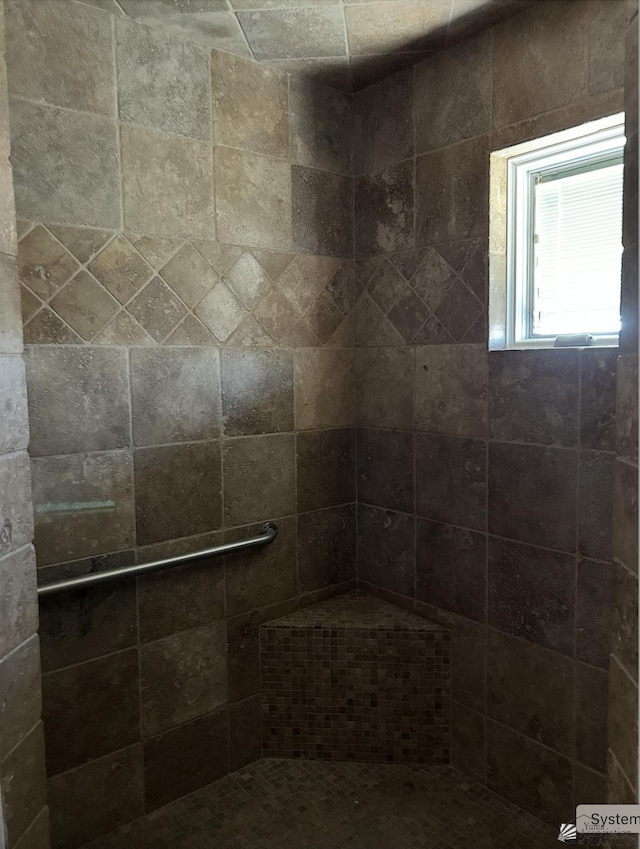 bathroom featuring tiled shower