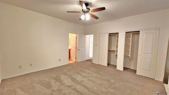 unfurnished bedroom featuring multiple closets, carpet flooring, ceiling fan, and baseboards