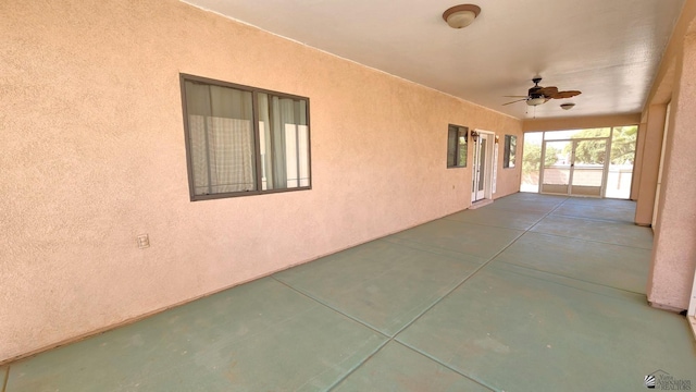 view of patio featuring ceiling fan