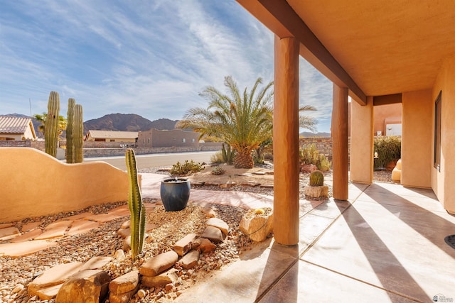 view of patio / terrace featuring a mountain view