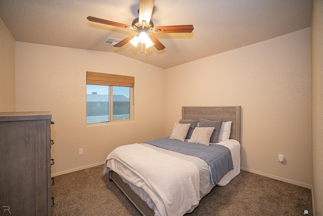 bedroom featuring baseboards, visible vents, vaulted ceiling, a ceiling fan, and dark carpet