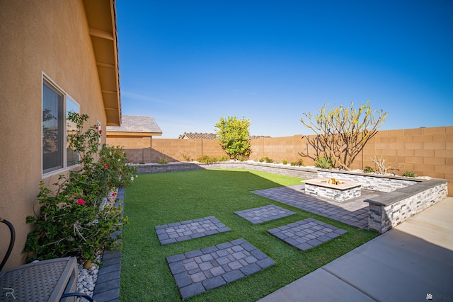 view of yard with a patio area and a fenced backyard