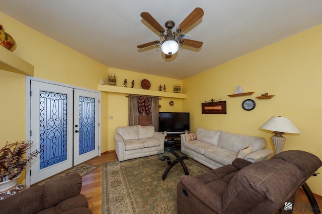 living room with ceiling fan, wood-type flooring, and french doors