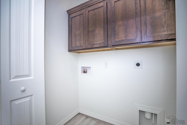 washroom featuring light wood-type flooring, cabinets, hookup for a washing machine, and electric dryer hookup