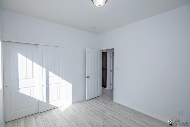 empty room with light hardwood / wood-style floors