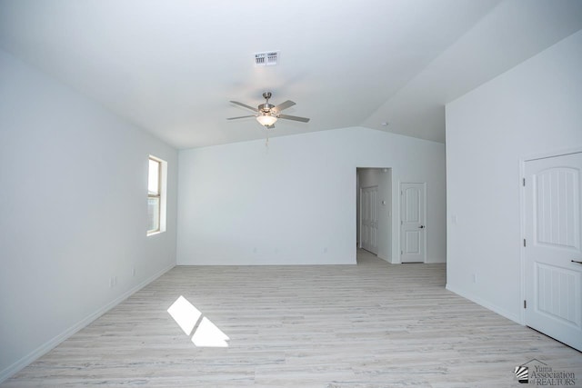 unfurnished room featuring ceiling fan, light wood-type flooring, and vaulted ceiling