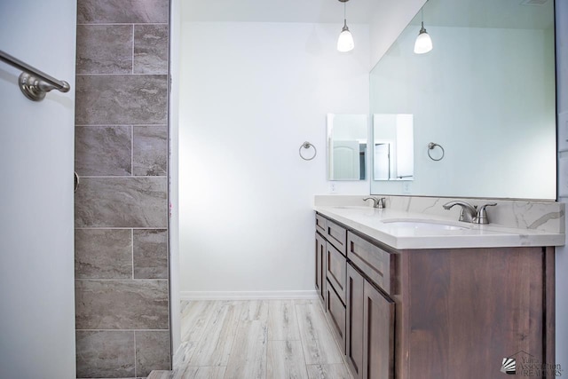 bathroom featuring hardwood / wood-style floors and vanity