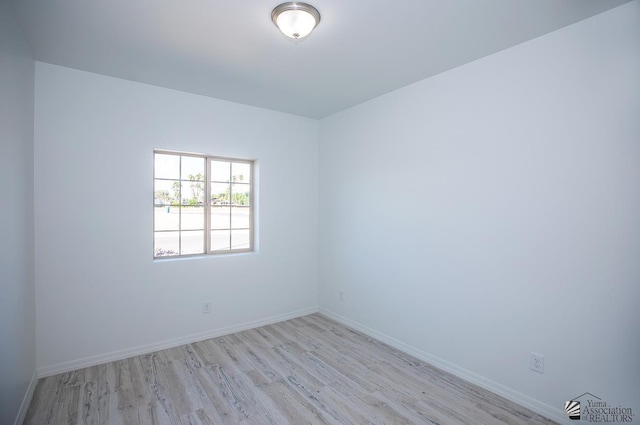 empty room with light wood-type flooring