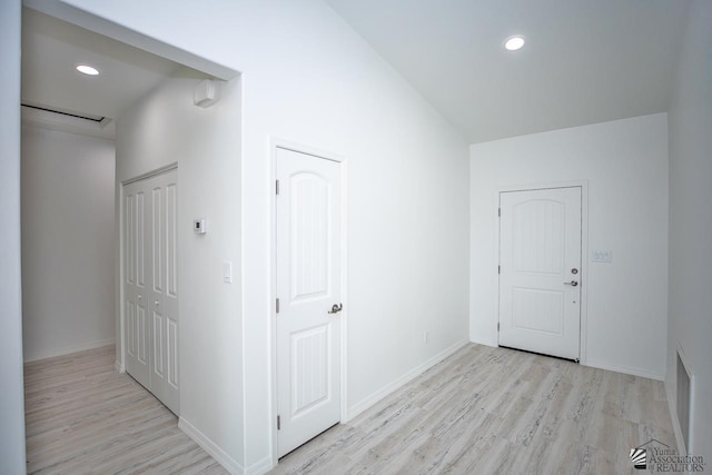 hall with light hardwood / wood-style floors