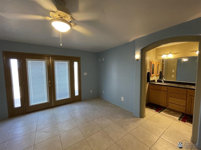 interior space featuring ceiling fan and sink