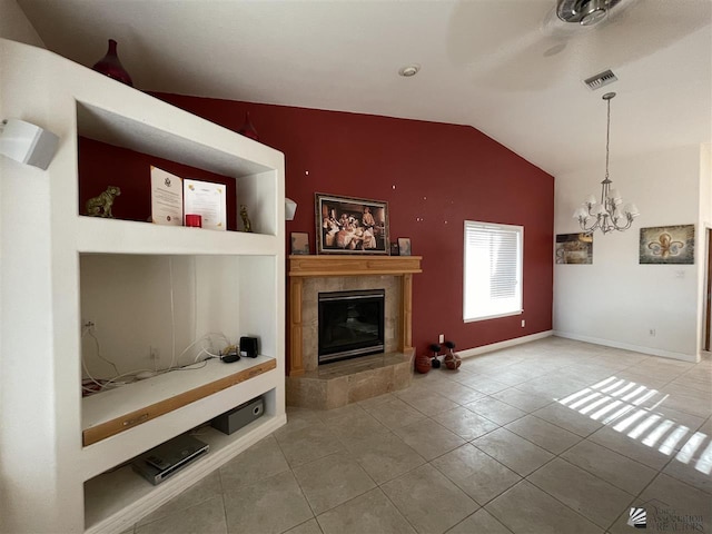 unfurnished living room with vaulted ceiling, tile patterned flooring, built in shelves, a fireplace, and a chandelier