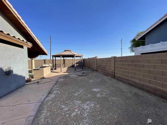 view of yard with a gazebo and a patio area