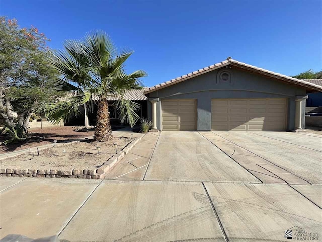 view of front of property featuring an outbuilding and a garage