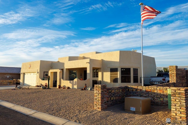 southwest-style home with a garage