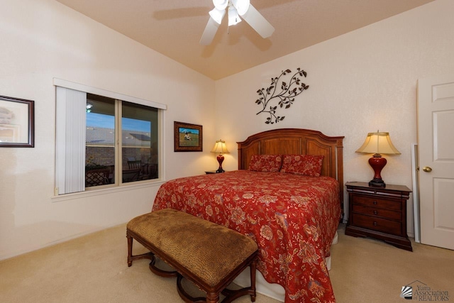 carpeted bedroom with ceiling fan and vaulted ceiling