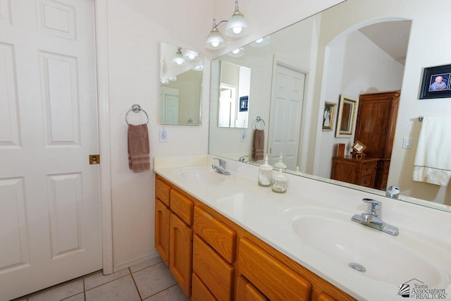 bathroom with vanity and tile patterned flooring