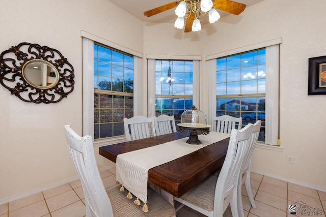 dining room featuring light tile patterned floors and ceiling fan