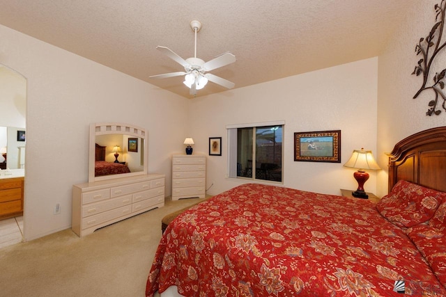 carpeted bedroom with ceiling fan and a textured ceiling