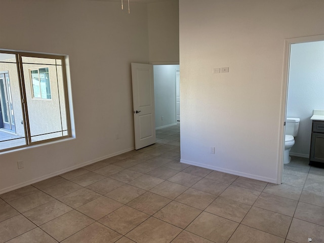 empty room with light tile patterned floors