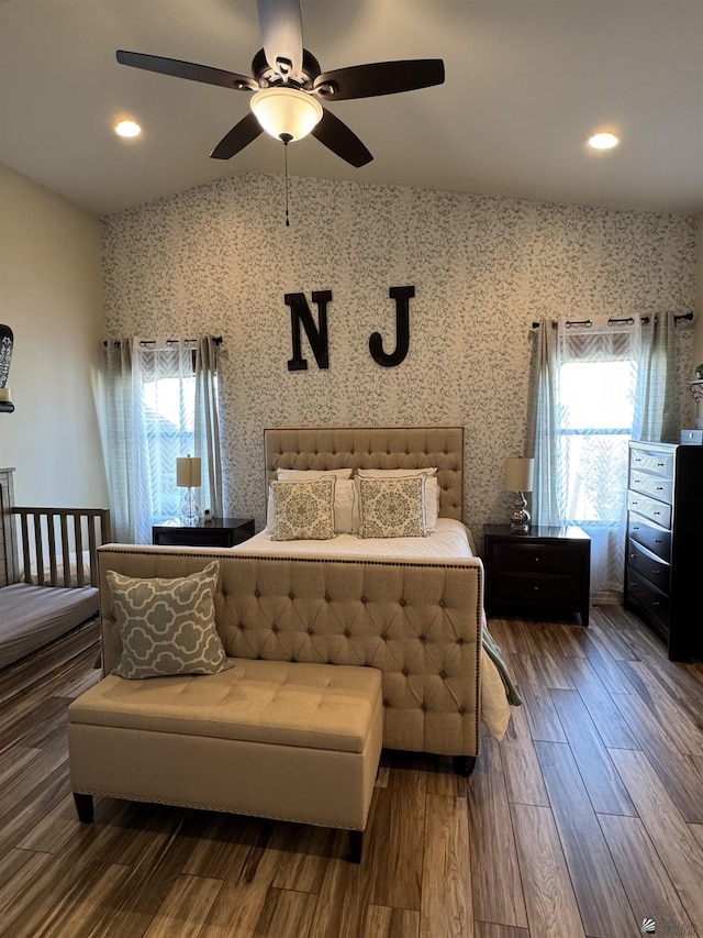 bedroom featuring lofted ceiling, dark wood-type flooring, and ceiling fan