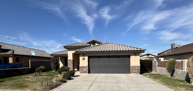 view of front of property with a garage and a front yard