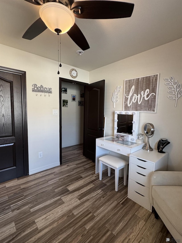 office area featuring dark hardwood / wood-style flooring and ceiling fan