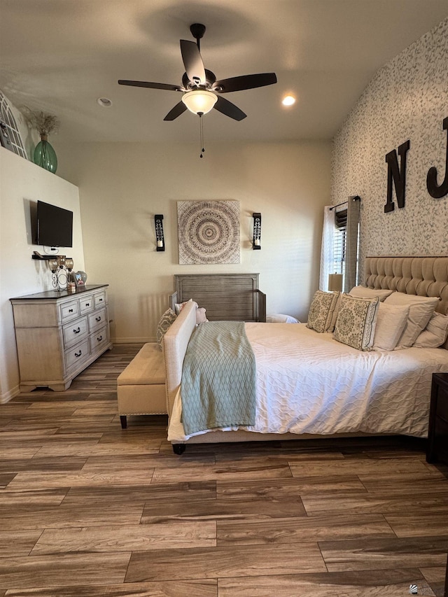 bedroom with ceiling fan and wood-type flooring