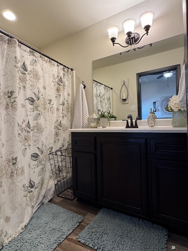 bathroom with hardwood / wood-style flooring and vanity