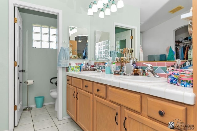 10243 Fairway Loop, Yuma, AZ 85367 - bathroom with tile patterned flooring, double vanity, and toilet