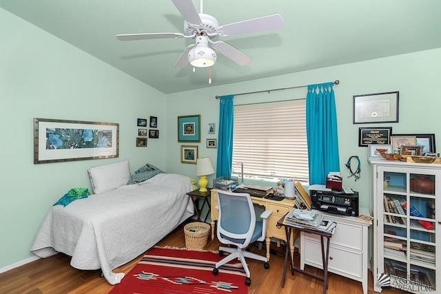 10243 Fairway Loop, Yuma, AZ 85367 - bedroom with wood finished floors, a desk, lofted ceiling, and ceiling fan