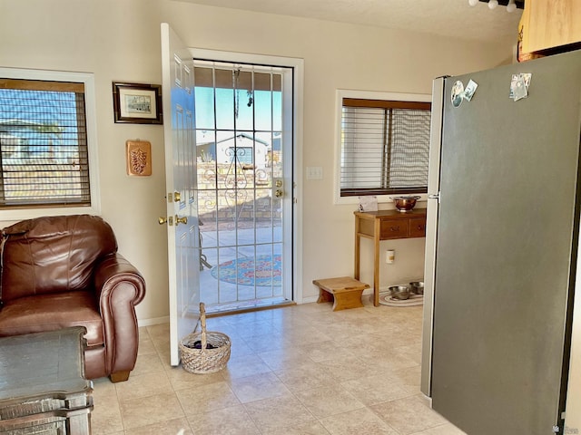 doorway featuring light tile patterned floors